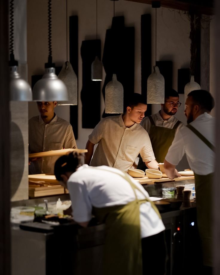 Chefs preparing dishes in the kitchen